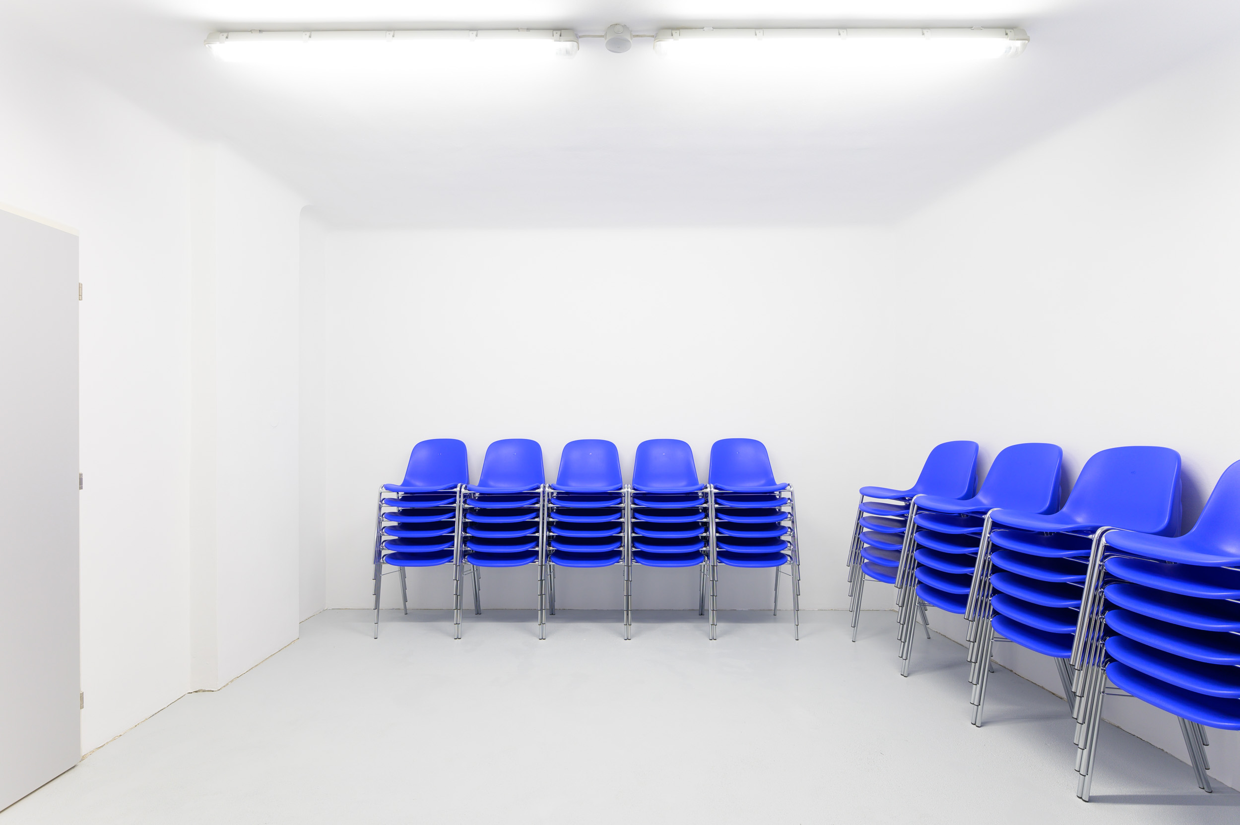 I thought I wanted to be there, but I wasn't sure (Chairs), 2021, 72 chairs, each individually marked, dimensions variable